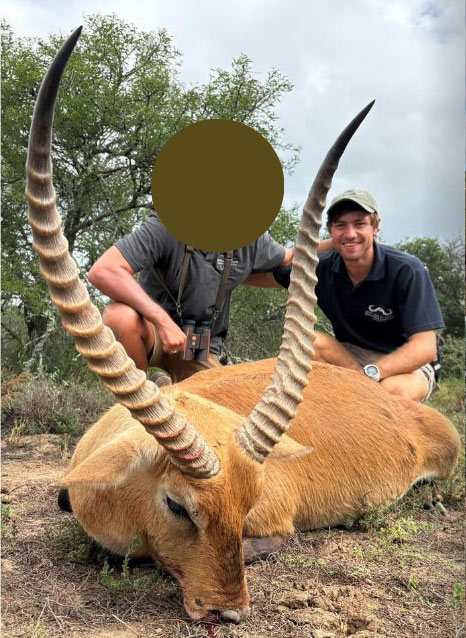 Spanish hunter with a Lechwe trophy during a plains game safari in South Africa