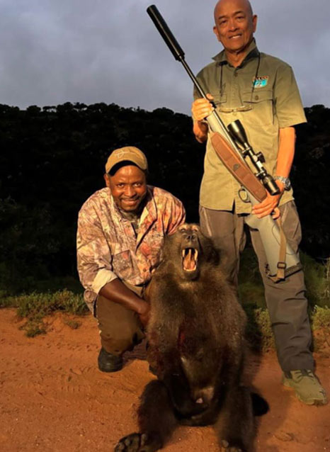 Alberto with his baboon trophy at last light during his South African safari